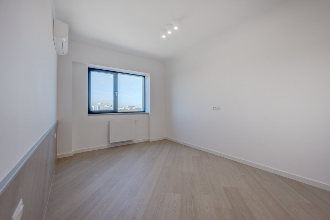 Apusul de la ultimul etaj din Cortina North | 3 camere | 76.7 mp